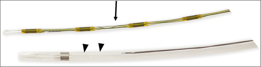 EKOS catheter (black arrow heads) with the ultrasound core wire (black arrow). Image provided courtesy of Boston Scientific. ©2020 Boston Scientific Corporation or its affiliates. All rights reserved.